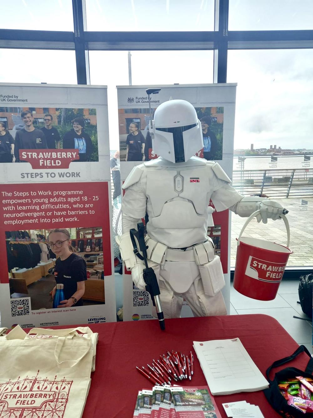 A storm trooper collecting change for Strawberry Field at Comic Con