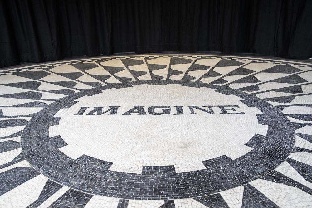 Black and white tile mosaic floor with word Imagine in the centre as tribute to John Lennon at Strawberry Field Liverpool