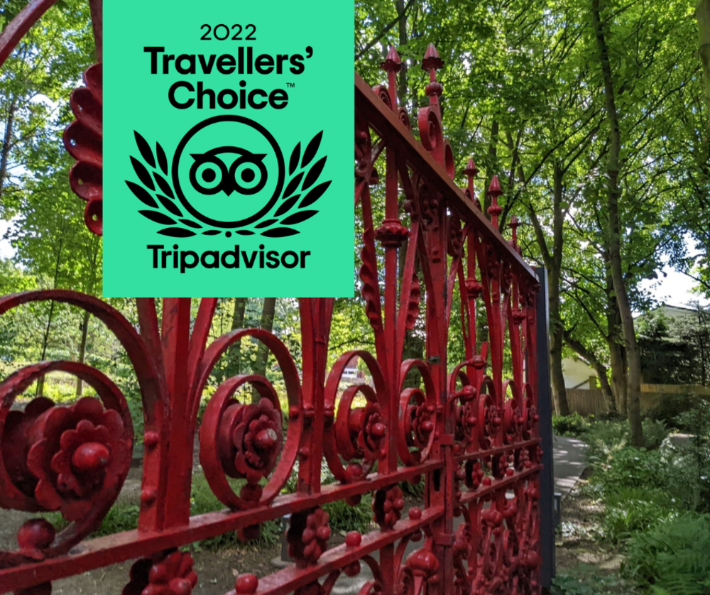 Strawberry Field red gate with Tripadvisor Travellers' Choice award logo