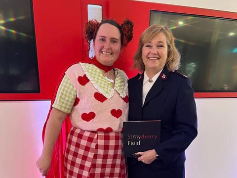 Great British Bake Off's Lizzie Acker with Strawberry Field Mission Director Major Kathy Versfeld stand together smiiling